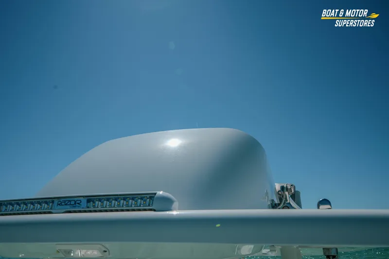 Slide: The Image of 2018 Barker Boatworks 26 Open under clear blue sky, featuring Razor light bar. - 64
