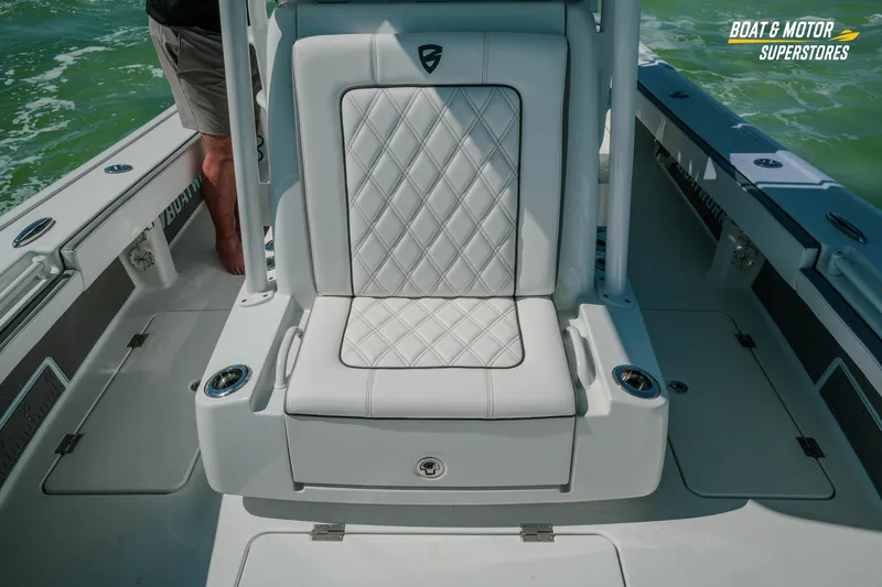 Slide: The Image of 2018 Barker Boatworks 26 Open with white cushioned seating on deck. - 66