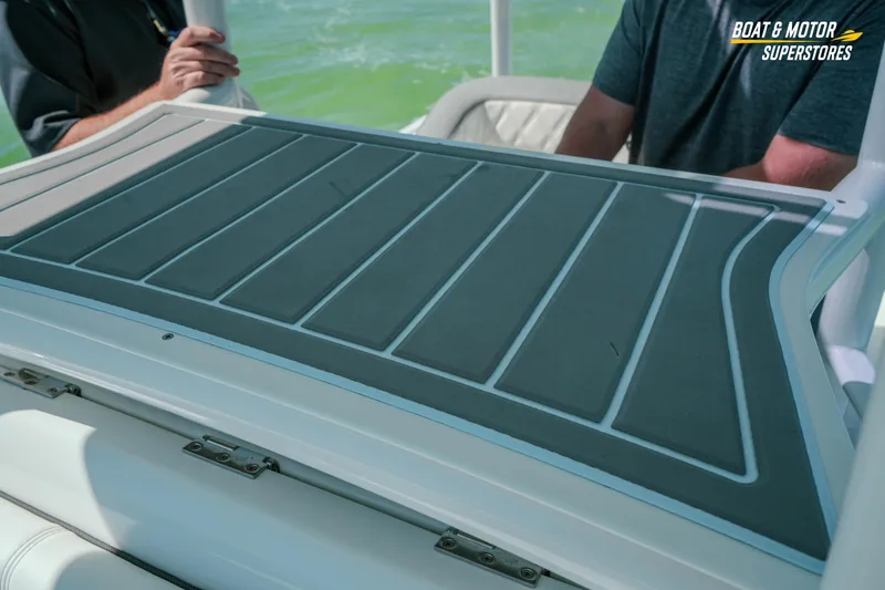 Slide: The Image of 2018 Barker Boatworks 26 Open deck detail with two people onboard. - 67