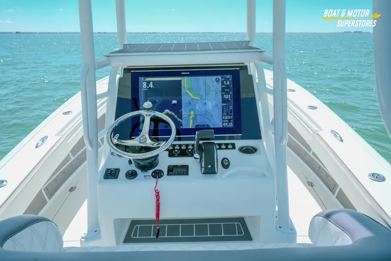 Slide: The Image of 2018 Barker Boatworks 26 Open helm with navigation display on open water. - 68