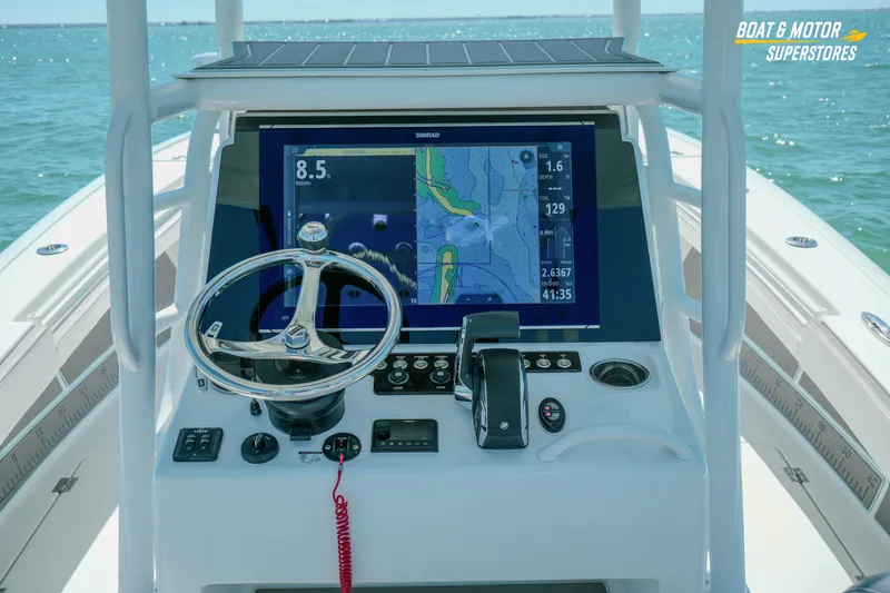 Slide: The Image of 2018 Barker Boatworks 26 Open helm with navigation display on open water. - 69