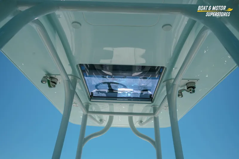 Slide: The Image of 2018 Barker Boatworks 26 Open T-top view with clear sky background. - 72