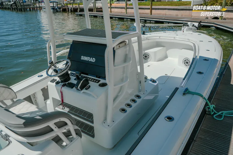 Slide: The Image of 2018 Barker Boatworks 26 Open at dock, featuring Simrad electronics and spacious deck. - 86