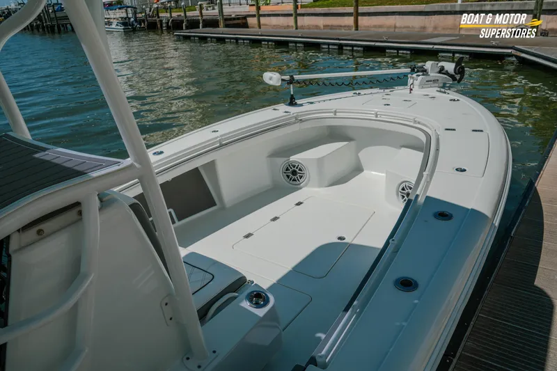 Slide: The Image of 2018 Barker Boatworks 26 Open at dock, showcasing spacious deck and sleek design. - 87