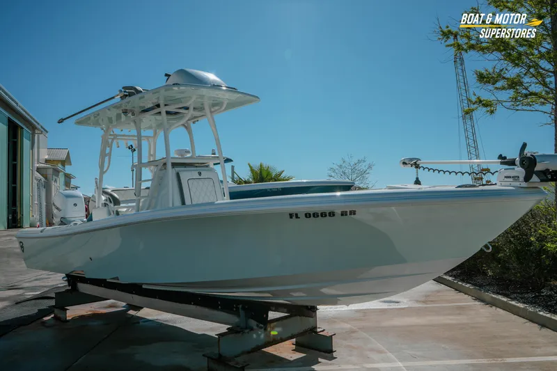 Slide: The Image of 2018 Barker Boatworks 26 Open on trailer at Boat & Motor Superstores under clear blue sky. - 9