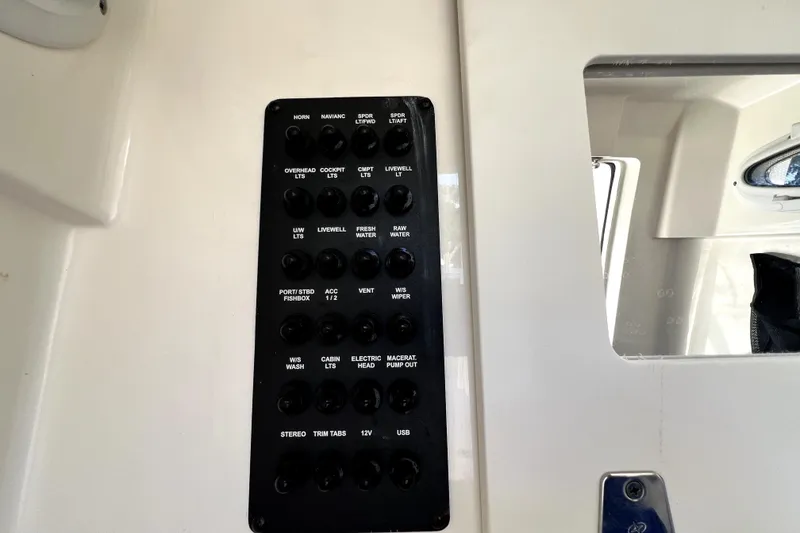 Slide: The Image of Control panel on a 2021 Cobia 240 Center Console boat. - 102