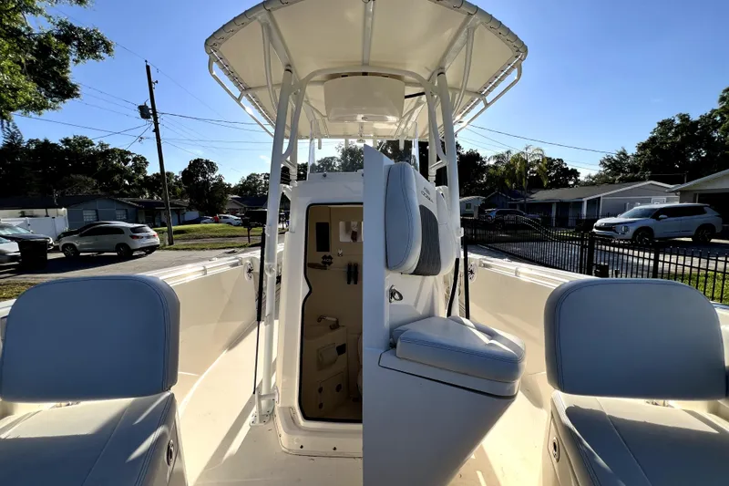 Slide: The Image of 2021 Cobia 240 Center Console boat interior with seating and console view. - 109