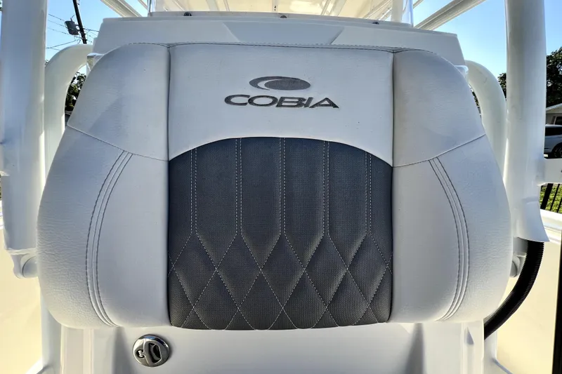 Slide: The Image of Cobia 240 Center Console 2021 boat seat with logo and diamond stitching. - 110