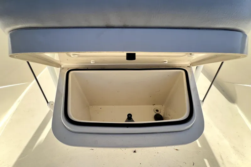 Slide: The Image of Open storage compartment on a 2021 Cobia 240 Center Console boat. - 111