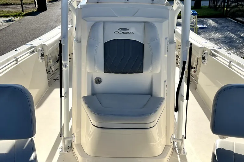 Slide: The Image of 2021 Cobia 240 Center Console boat interior with cushioned seating and sleek design. - 117