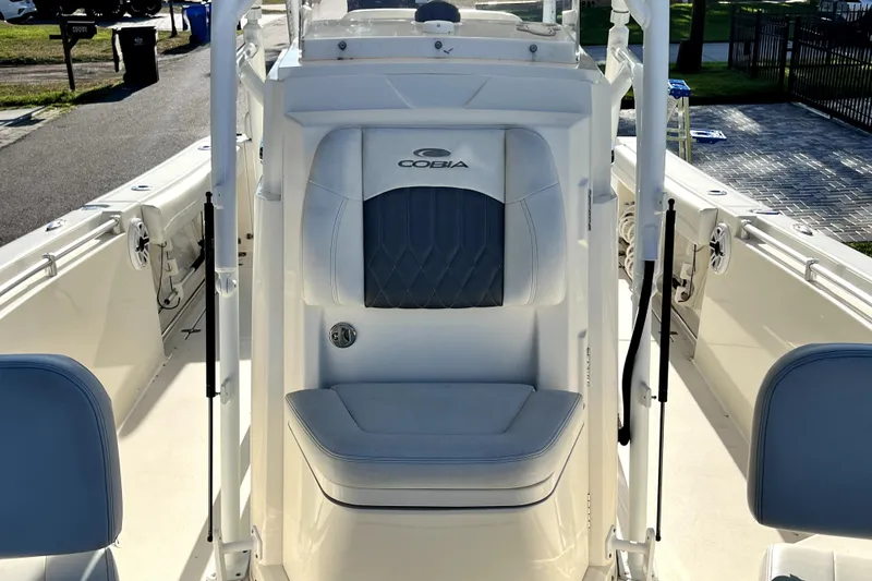 Slide: The Image of 2021 Cobia 240 Center Console boat interior with cushioned seating and sleek design. - 118
