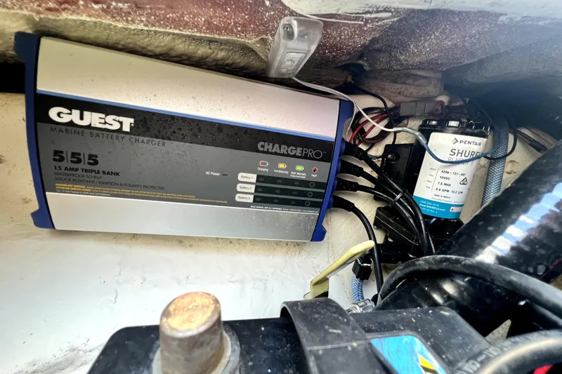 Slide: The Image of Marine battery charger setup in a 2021 Cobia 240 Center Console boat. - 119