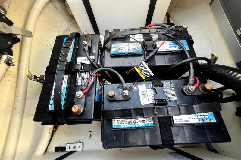 Slide: The Image of Batteries in a 2021 Cobia 240 Center Console boat, showing wiring and connections. - 120
