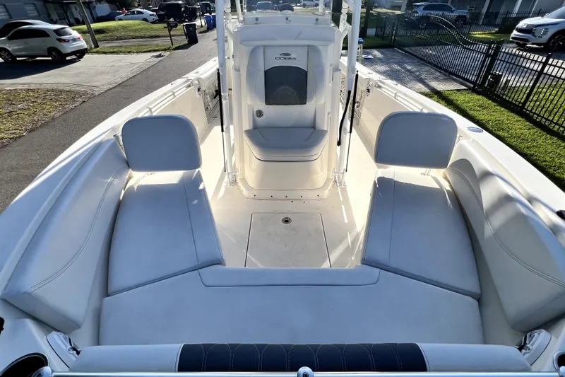 Slide: The Image of 2021 Cobia 240 Center Console boat interior with seating and console view. - 123