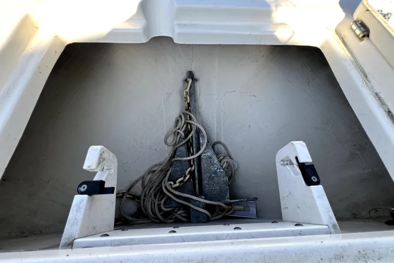 Slide: The Image of Anchor storage compartment on a 2021 Cobia 240 Center Console boat. - 124