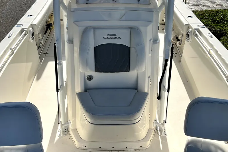 Slide: The Image of 2021 Cobia 240 Center Console boat interior with seating and console view. - 125