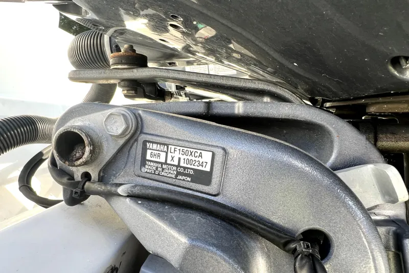 Slide: The Image of Close-up of Yamaha LF150XCA engine part on 2021 Cobia 240 Center Console boat. - 23