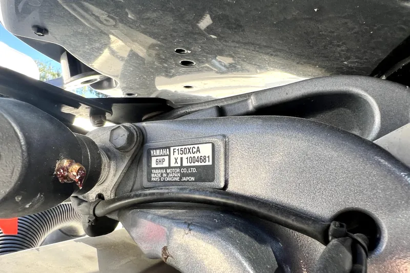 Slide: The Image of Yamaha F150XCA engine on 2021 Cobia 240 Center Console boat. - 26