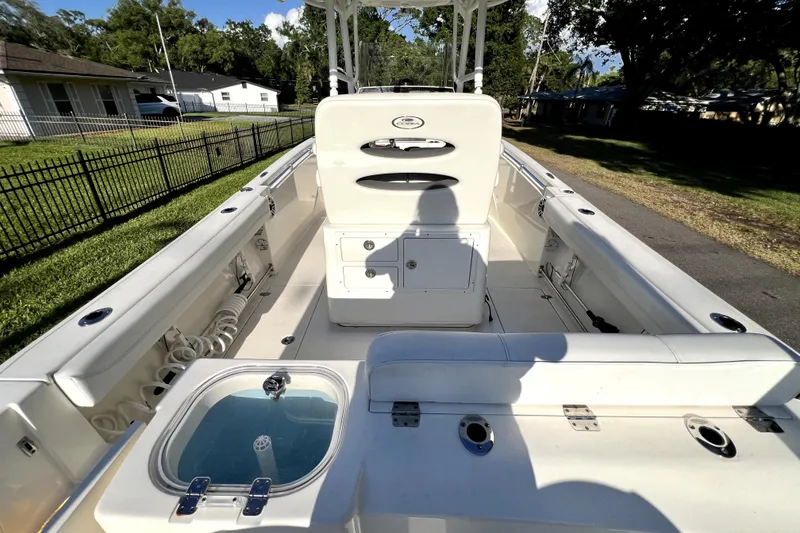 Slide: The Image of 2021 Cobia 240 Center Console boat interior with seating and storage compartments. - 30