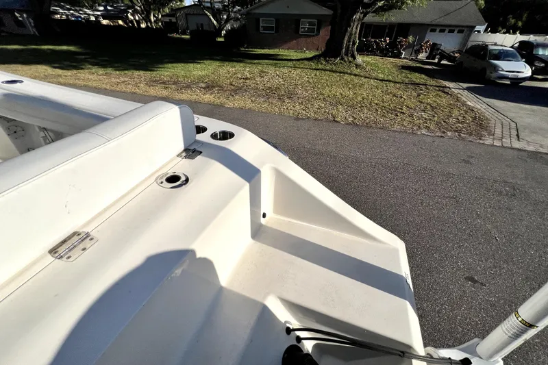 Slide: The Image of 2021 Cobia 240 Center Console boat parked on a residential street. - 31