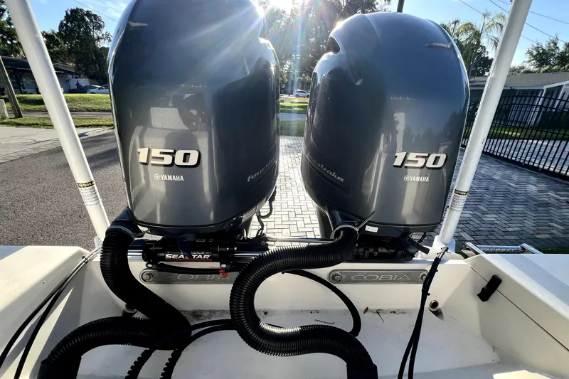 Slide: The Image of Twin Yamaha 150 engines on a 2021 Cobia 240 Center Console boat. - 36