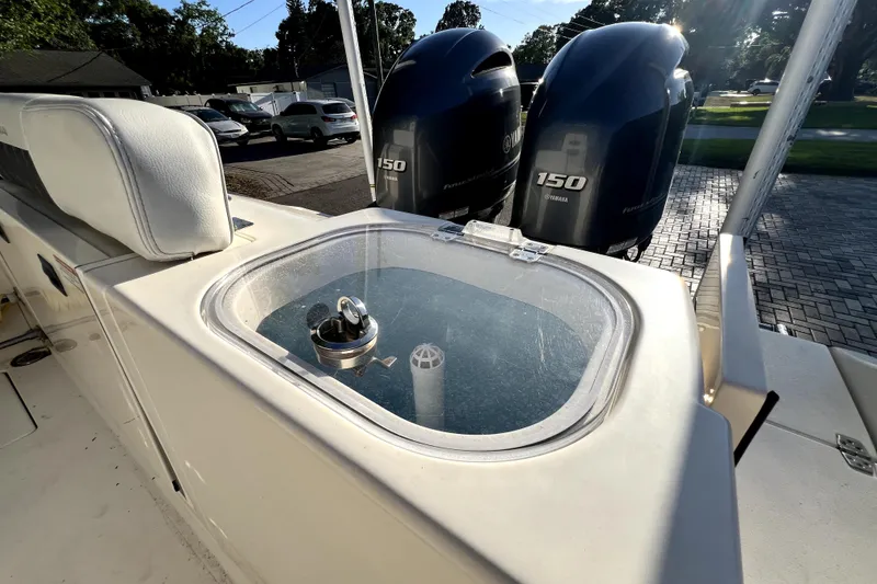 Slide: The Image of 2021 Cobia 240 Center Console boat with Yamaha 150 engines and livewell. - 44