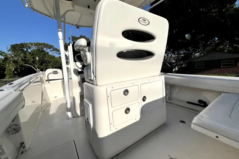 Slide: The Image of 2021 Cobia 240 Center Console boat interior with seating and storage compartments. - 46