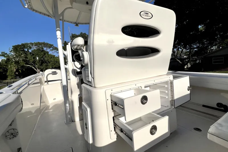 Slide: The Image of 2021 Cobia 240 Center Console boat interior with open storage compartments. - 49