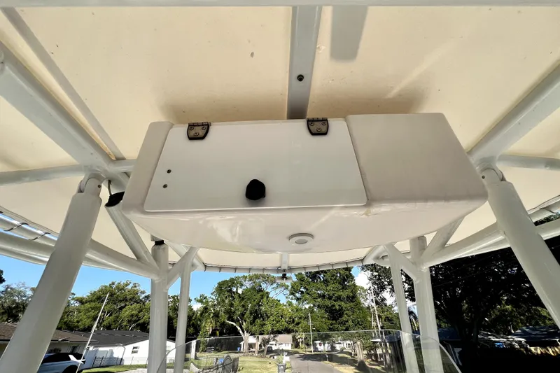 Slide: The Image of 2021 Cobia 240 Center Console boat's T-top storage compartment, viewed from below. - 59