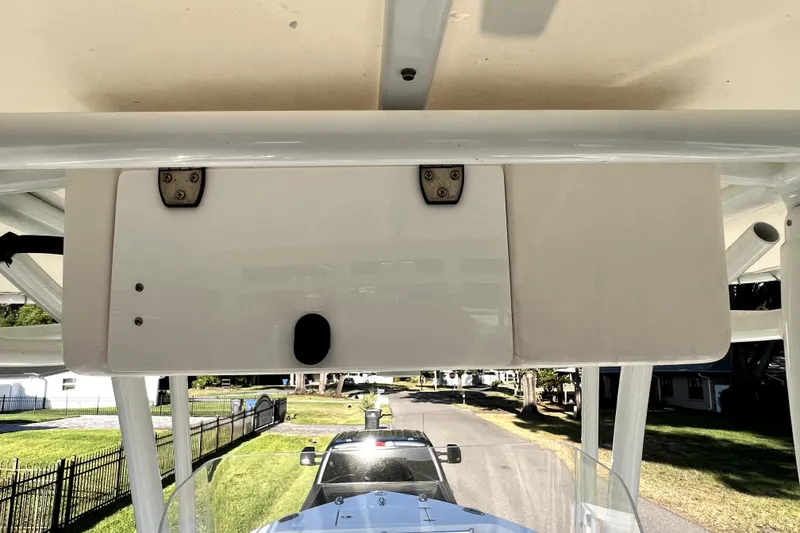 Slide: The Image of 2021 Cobia 240 Center Console boat detail with overhead storage compartment. - 67
