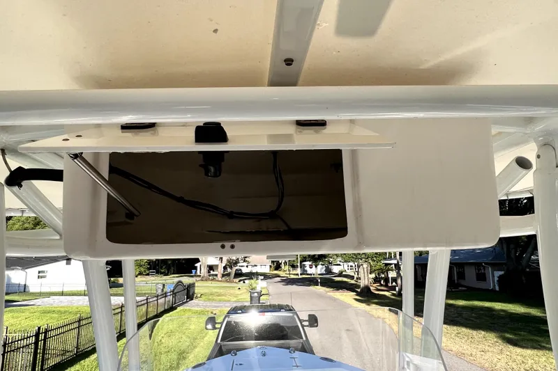 Slide: The Image of Open storage compartment on a 2021 Cobia 240 Center Console boat. - 68