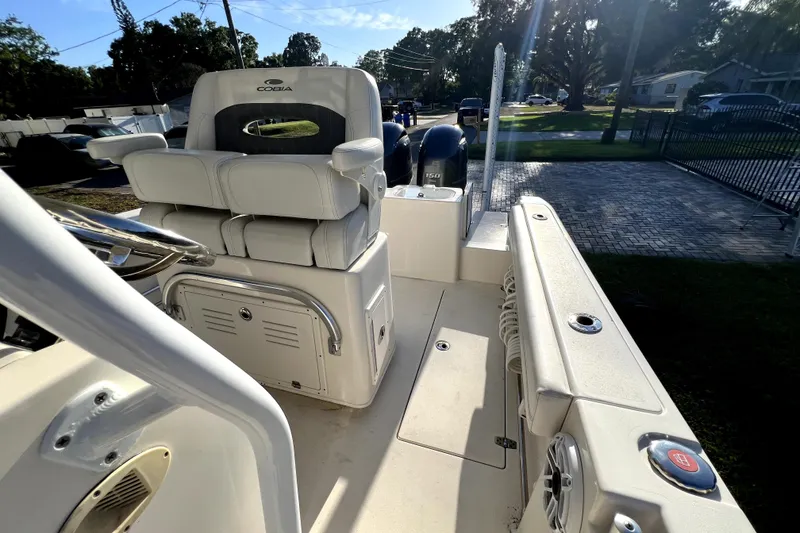 Slide: The Image of 2021 Cobia 240 Center Console boat interior with seating and dual engines. - 72