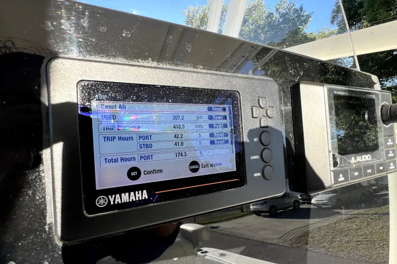 Slide: The Image of Yamaha display on 2021 Cobia 240 Center Console showing trip and total hours. - 76