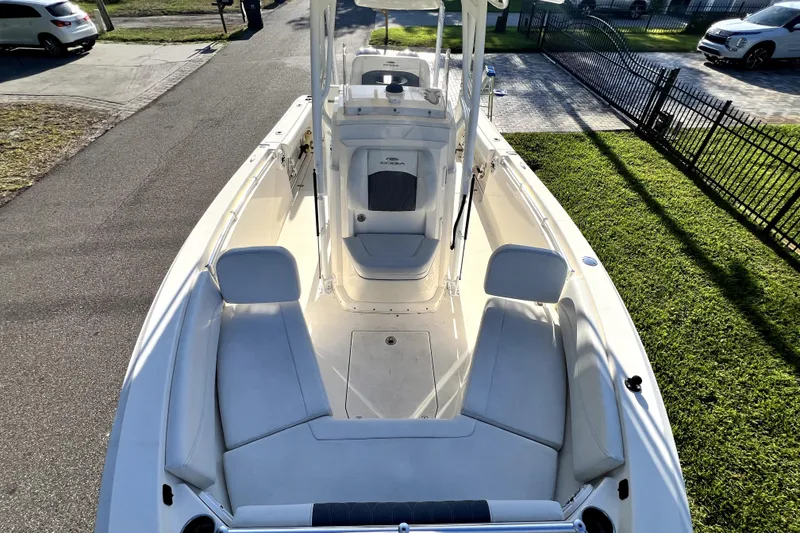 Slide: The Image of 2021 Cobia 240 Center Console boat with spacious seating and sleek design. - 79