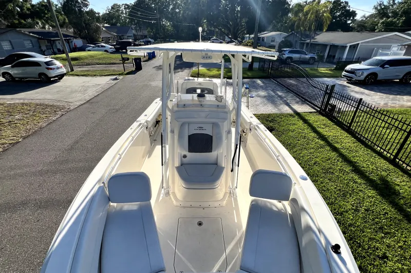 Slide: The Image of 2021 Cobia 240 Center Console boat parked in a residential driveway. - 80
