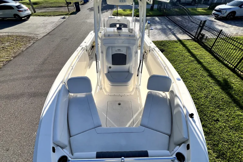 Slide: The Image of 2021 Cobia 240 Center Console boat with spacious seating and sleek design. - 81