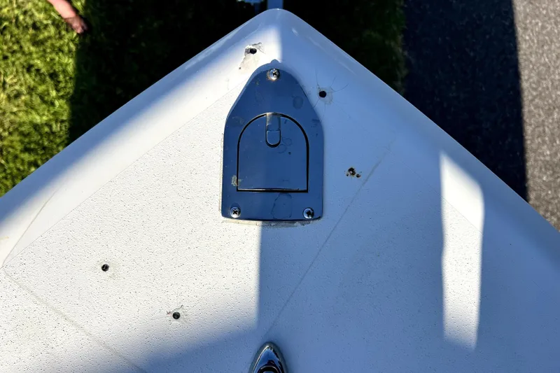 Slide: The Image of Bow of a 2021 Cobia 240 Center Console boat with metal fittings. - 82