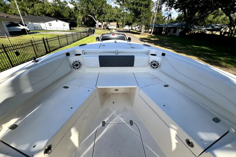 Slide: The Image of 2021 Cobia 240 Center Console boat interior with seating and speakers. - 86