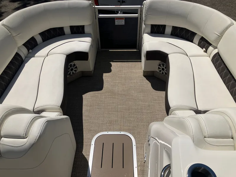 Slide: The Image of Interior of a 2019 Bennington 23 QLC pontoon boat with luxurious seating. - 16