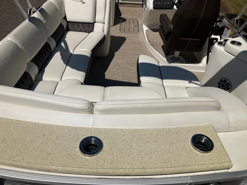 Slide: The Image of Interior of a 2019 Bennington 23 QLC pontoon boat with beige seating. - 8