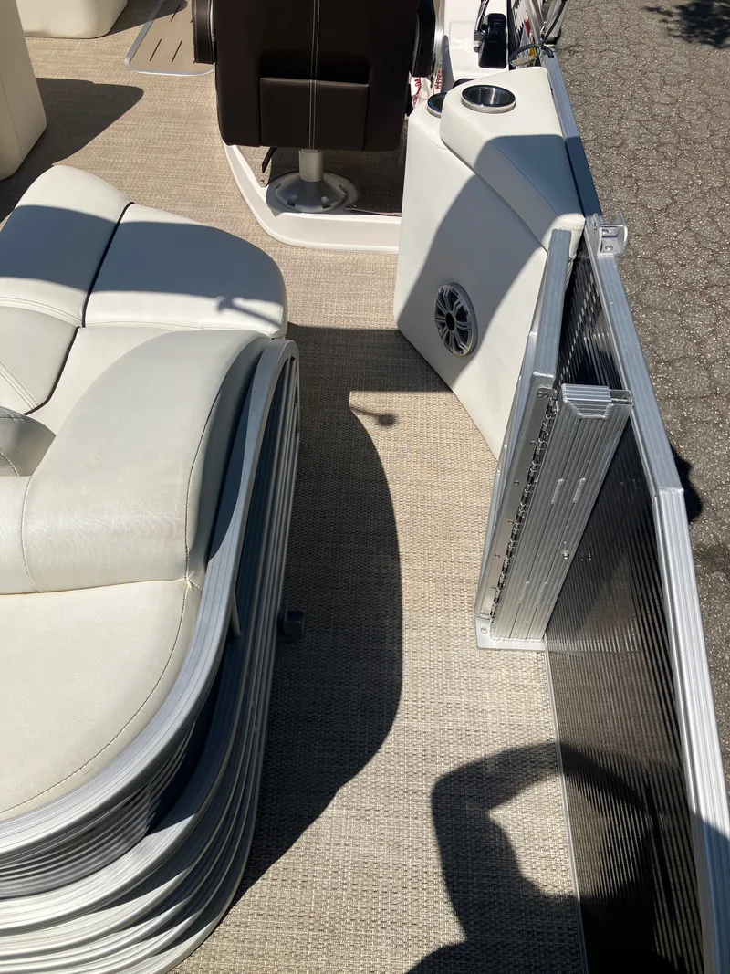 Slide: The Image of Interior of a 2019 Bennington 23 QLC pontoon boat with seating area. - 9