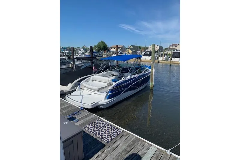 Slide: The Image of 2016 Formula 290 Bowrider docked at marina with blue canopy. - 4