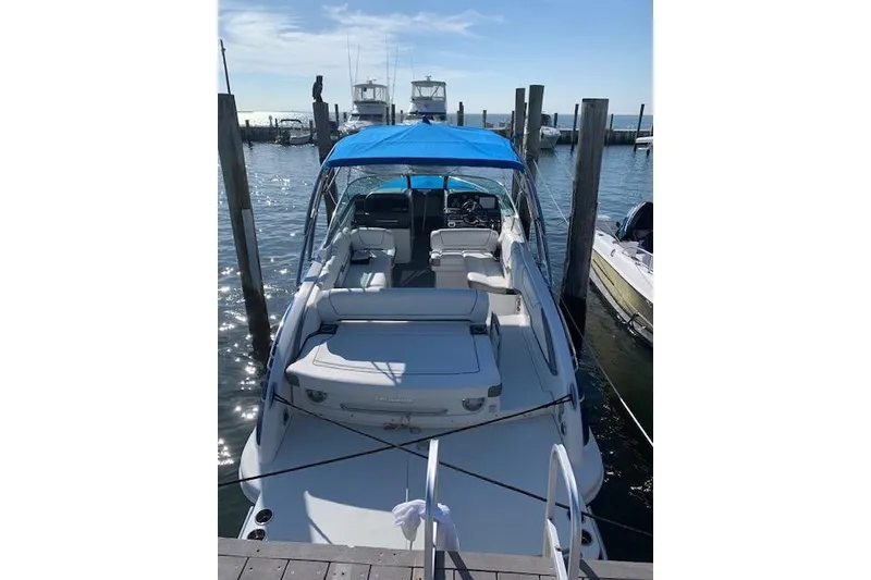 Slide: The Image of 2016 Formula 290 Bowrider docked with blue canopy, sunny day. - 6