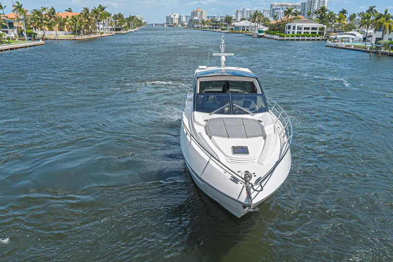 Slide: The Image of 2021 Sunseeker Predator 60 EVO yacht cruising in a scenic waterway. - 10