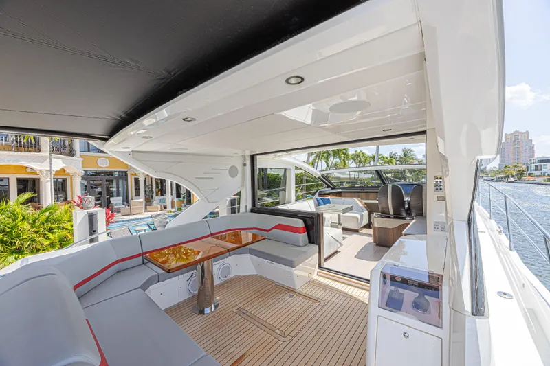 Slide: The Image of Luxurious 2021 Sunseeker Predator 60 EVO yacht interior with elegant seating and waterfront view. - 22