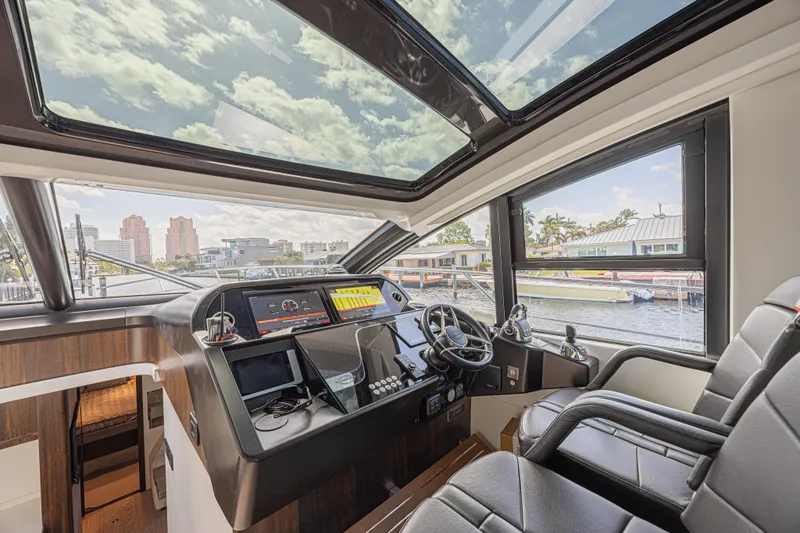 Slide: The Image of Interior cockpit of 2021 Sunseeker Predator 60 EVO yacht with modern controls and panoramic windows. - 33
