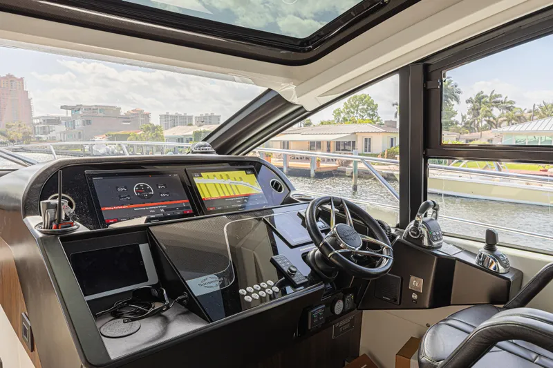 Slide: The Image of Helm of 2021 Sunseeker Predator 60 EVO yacht with modern navigation displays. - 34