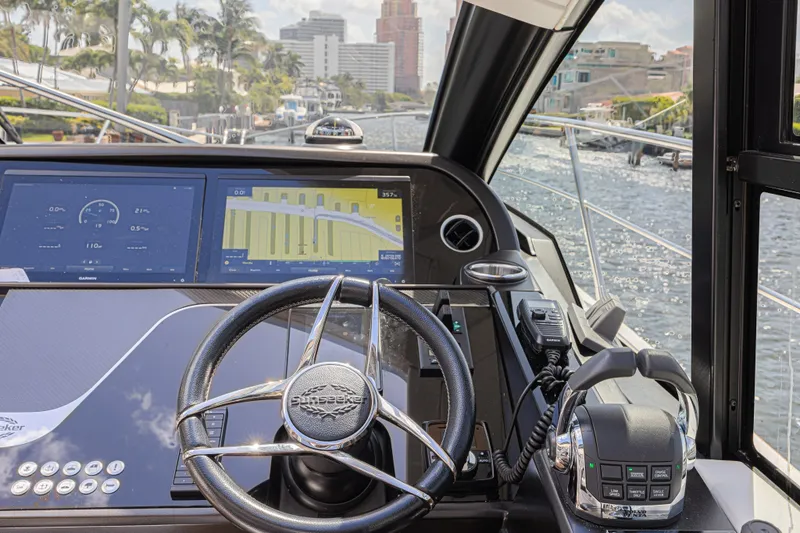 Slide: The Image of Cockpit view of 2021 Sunseeker Predator 60 EVO yacht with navigation screens. - 37
