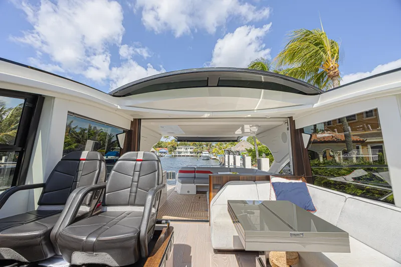 Slide: The Image of Luxurious interior of 2021 Sunseeker Predator 60 EVO yacht with sleek seating and open roof. - 39