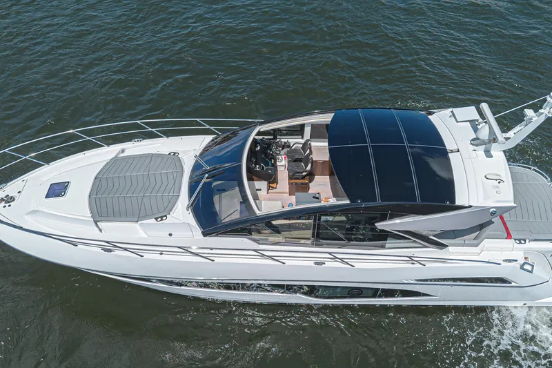 Slide: The Image of 2021 Sunseeker Predator 60 EVO yacht cruising on open water, aerial view. - 4